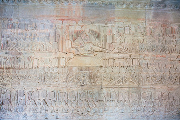 Fototapeta na wymiar Stone Carving, all around on the wall at Angkor wat.
