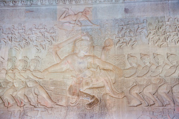 Stone Carving, all around on the wall at Angkor wat.