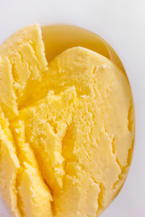 Boiled egg in a cut very close up. Yellow crumbly yolk. Macro photo suitable as background.