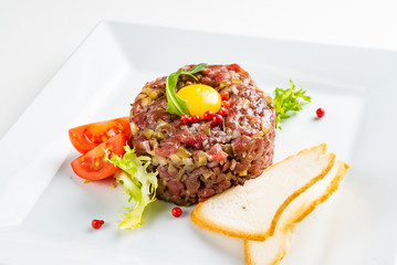 French cuisine, beef steak tartare with raw quail egg yolk