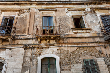 The facade of an old house in the Italian style. Close-up.