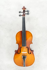 Fototapeta na wymiar top view of classical cello on grey textured background