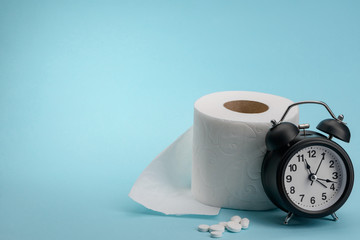 Pills, toilet paper and clock