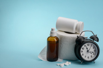 Toilet paper, medicine and clock