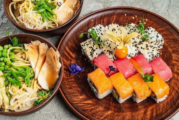 Rainbow Sushi Roll with salmon, eel, tuna, avocado, royal prawn, cream cheese Philadelphia, caviar tobica, chuka. Sushi menu. Japanese food