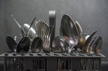 spoons and forks in the dishwasher basket