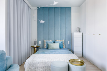 Bedroom with upholstered wall