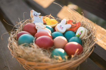 basket with painted colorful easter eggs 