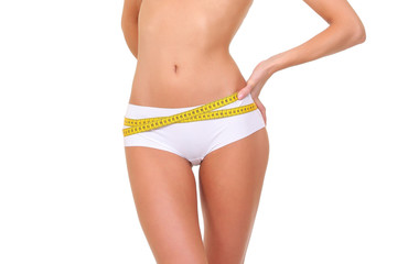 Woman measuring her slim body