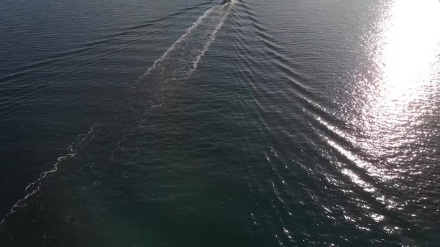 Drone Aerial footage of a boat in the Lofoten Islands, Norway during winter