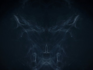 smoke abstract texture , magical scary devil fire at night . scream of ghost horror in halloween . symmetry fractal swirl gas in the air