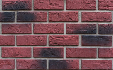 Brown brick wall background-vector.Brick wall red, red with black brick.Background.Gasket.Black.Dark red.Brick.Plastic.