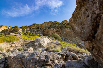 cliffs with green vegetation and blue sky