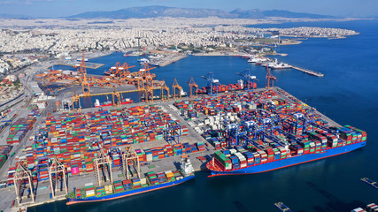 Aerial photo of industrial cargo container loading terminal located in mediterranean port - obrazy, fototapety, plakaty