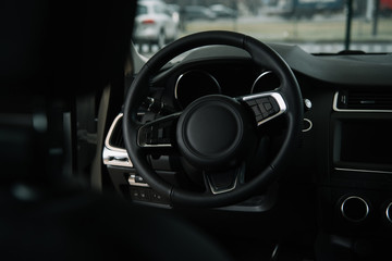 selective focus of steering wheel in luxury car