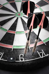 darts target and arrow