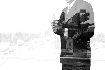 Double Exposure of Businessman Use Wireless Mobile Smartphone with Highway construction site