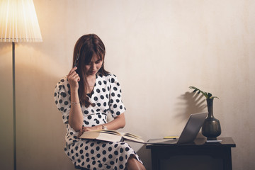 woman reading book with happy.