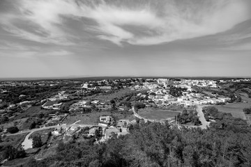 view area with vast plain with their houses and the background sky with white clouds