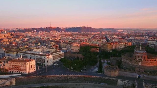 rome skyline aerial shot at dawn pan from castel sant'angelo to st peter basilica