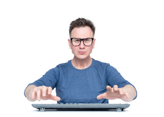 Man in glasses working at the computer, his hands hover over the keyboard while typing, isolated on...