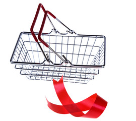 Shopping basket and red satin ribbon on a white background.