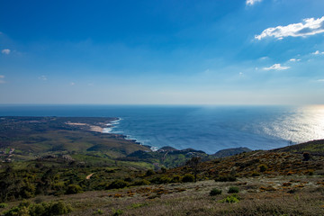 Fototapeta na wymiar Green mountain with the sea in horizon