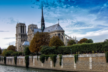 Fototapeta na wymiar View of the back of the cathedral of Notre Dame de Paris from the Seine river in Paris. France
