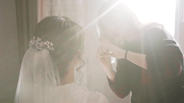 makeup artist girl preparing for the wedding bride