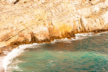 Steep rocky sea shore beautiful sunny day in Crimea.