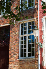 colorful houses with lantern in street Steenhouwersdijk  in historic city Brugge, Bruges, Belgium