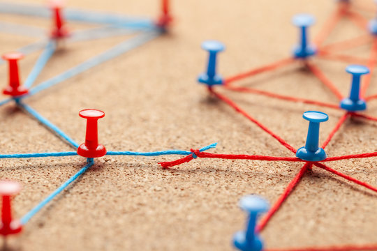 Business Team. Connect Between Business People. Contract Arrangements. Office Pins Connected By Blue And Red Thread And Contract Between The Teams