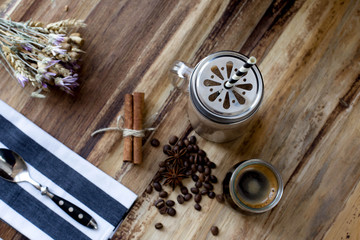 Refreshing homemade cocktail with coconut milk, chocolate and ice.  flowers  goritsa.  straw.