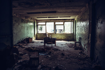 Fototapeta na wymiar Abandoned ruined industrial building room inside interior, dark dirty grunge and creepy atmosphere