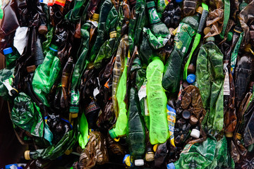 Plastic bales of rubbish at the waste treatment processing plant. Recycling separatee and storage of garbage for further disposal, trash sorting. Business for sorting and processing of waste.