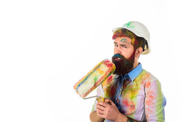 Repair. Painter. Bearded painter holds paint roller. Painter with painting roller. Room painting....