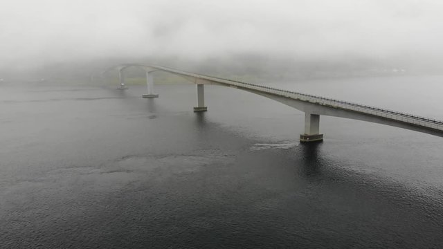 Aerial view. Bridge over fjord on Lofoten islands. Summer time, foggy hazy day, overcast weather