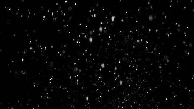 White powder splash isolated on black background. Stock footage. White dry inks explosion in abcolute darkness.
