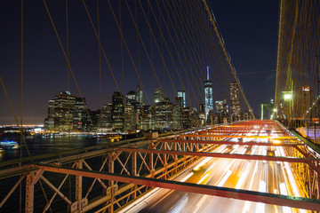 Fototapeta na wymiar A long exposure of cars leaving Manhattan over the Brooklyn Bridge.