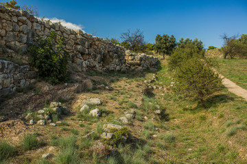 Fototapeta na wymiar archeology stone ruins in park outdoor country side green hill land