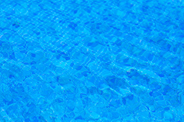 water ripples in swimming pool, blue background