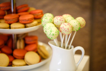 Delicious cake pops on candy bar