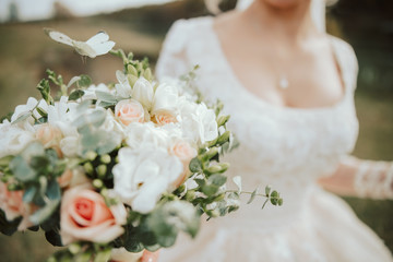 Bride with a bouquet of flowers and butterfly. 