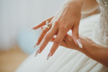 bride tries on ring