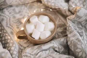 Fototapeta na wymiar Breakfast in bed. Cogee cup with marshmallows. Sweet home. flat lay, top view