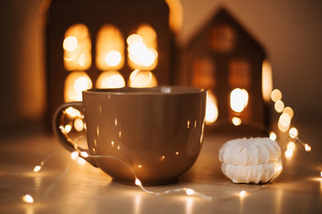 Coffee cup with marshmallows. Weekend coffee. Still life on dark background. Sweet home. Flat lay