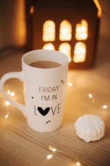 Coffee cup with marshmallows. Weekend coffee. Still life on dark background. Sweet home. Flat lay