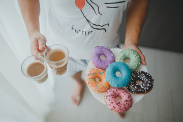 man brought keeps donuts and coffee