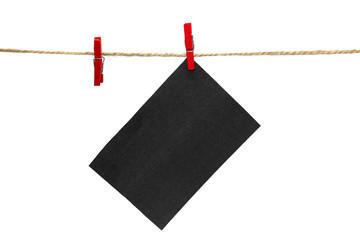 Black paper sheet for your text on the rope with a clothespin