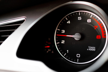 Luxury car steering wheel and dashboard with monitor.